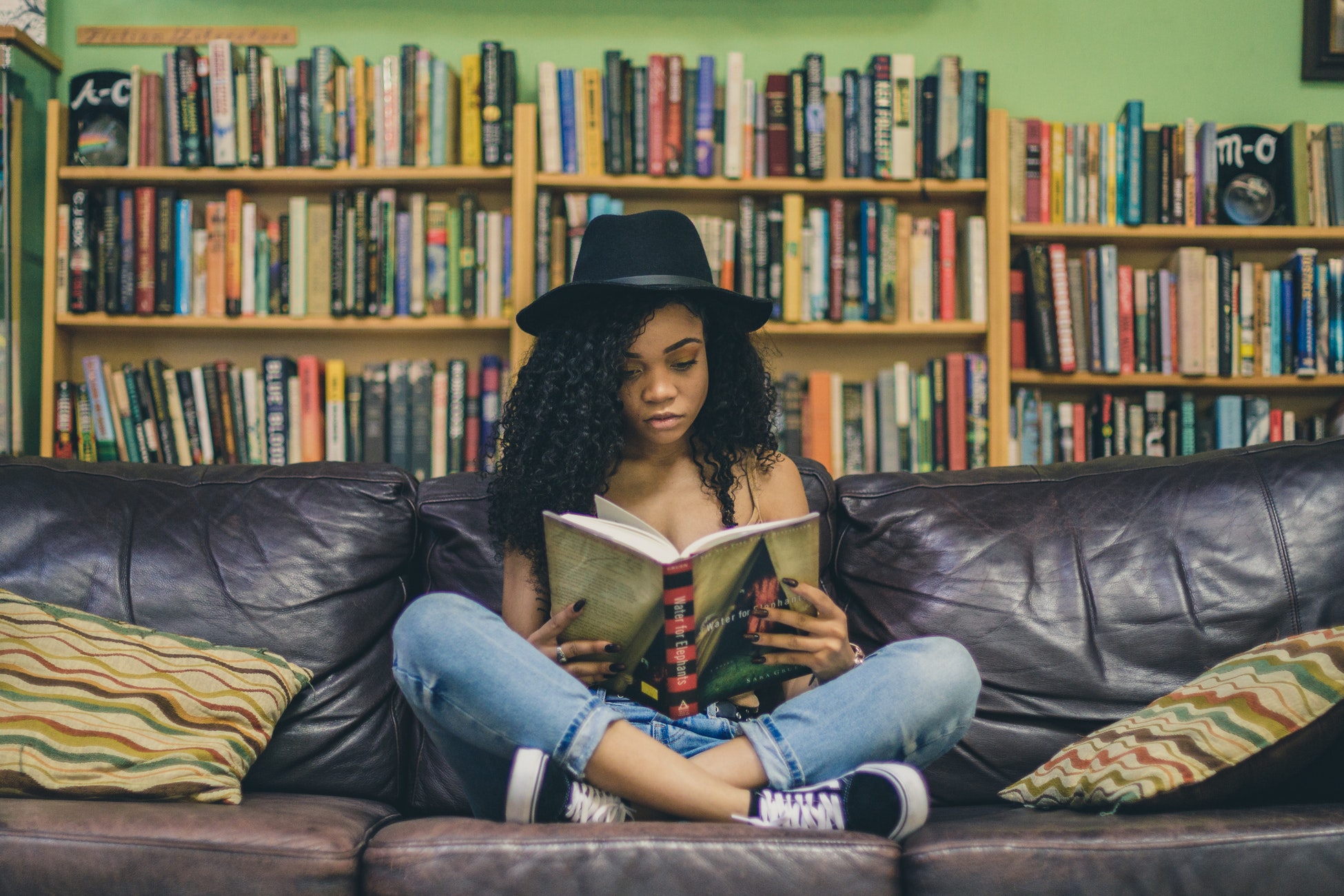 5 Books that Change Your Perspective on Life - Girl Reading in a Library