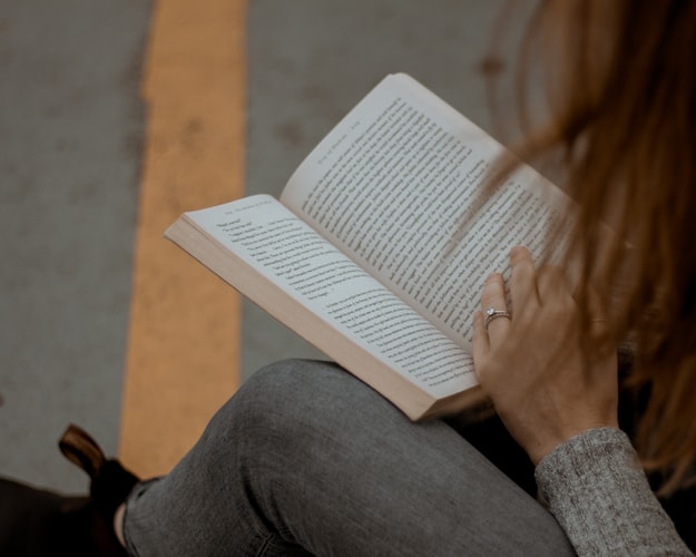 Girl Reading Book: 5 Must-Read Fiction Series