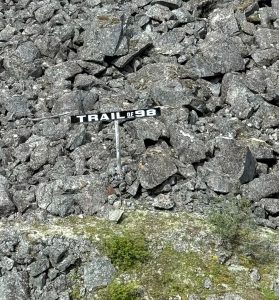 Cara Newman trail of 98 sign